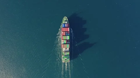 Aerial top down view large container cargo ship traveling with slow speed over Stock Footage 336446677