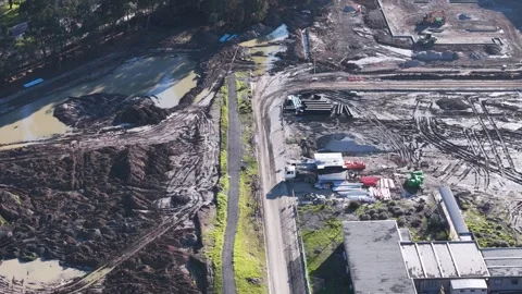 Aerial top-down view of a large muddy construction site Stock Footage 341272203