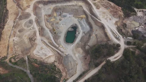 Aerial top-down view of large open pit mine Видео 343624128