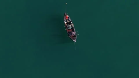 Aerial Top Down View of Local Fishermen Pulling Net in Phuket, Thailand Stock Footage 340337384