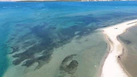Aerial Top-Down View of a Long Sandbar in Crystal Clear Turquoise Water Stock Footage 331728702