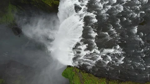 Aerial top down view looking over Skogafoss waterfall, Iceland Stock Footage 163341743