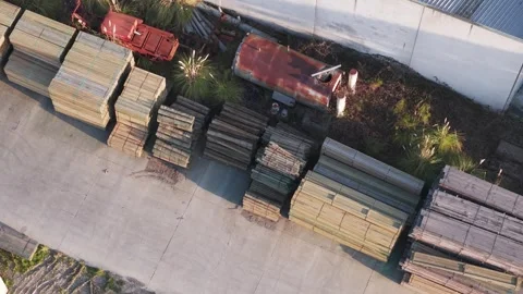 Aerial top down view of a lumberyard with stacks of wood Stock Footage 346374886