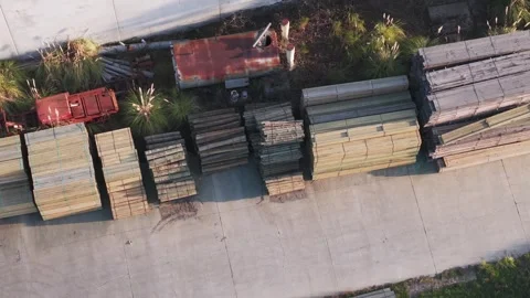 Aerial top down view of lumberyard with wood stacks 動画素材 346375075