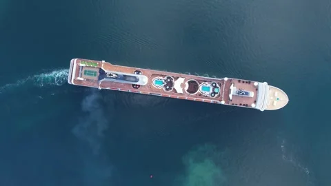 Aerial top down view of Luxurious Cruise ship maneuvering vessel on the buoy Stock Footage 303004096