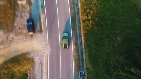 Aerial top down view of luxury supercar sport car driving on a mountain road Stock Footage 330956830