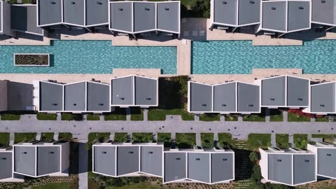 Aerial top down view of a luxury resort with swimming pools and villas Video stock 336958550