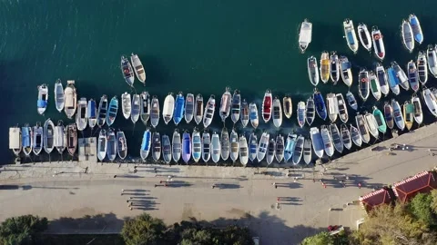 Aerial top down view many boats moored to embankment Stock Footage 153519414