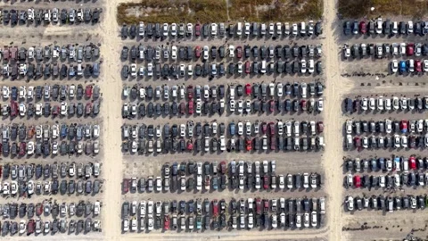 Aerial top down view of many damaged cars stored in a large parking lot Stock-Footage 339128553
