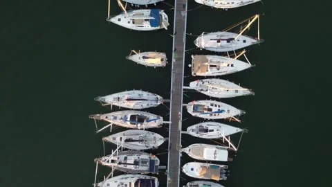 Aerial top-down view of marina pier with sailing yachts, Livorno Video stock 345132176