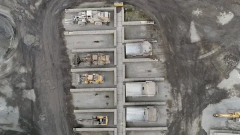 Aerial top down view of mining vehicle parking lot 4k Stock Footage 105864157