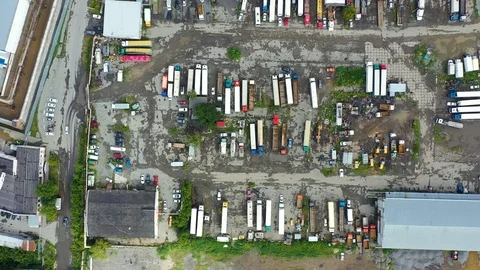 Aerial top down view of mining vehicle parking lot located at steel making Video stock 113532996