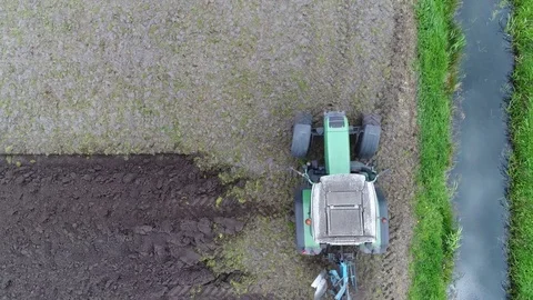 Aerial top-down view modern tractor making u-turn 4k Stock Footage 83464493