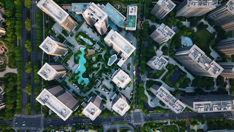 Aerial top down view of modern residential area featuring greenery, water Stock Footage 308837225