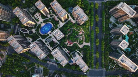 Aerial top down view of modern residential area featuring greenery, water Stock-Footage 308837378