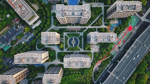 Aerial top down view of modern residential area featuring greenery, water Stock Footage 309792698