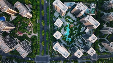 Aerial top down view of modern residential area featuring greenery, water Stock Footage 310501286