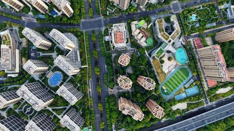 Aerial top down view of modern residential area featuring greenery, water Video stock 310501591