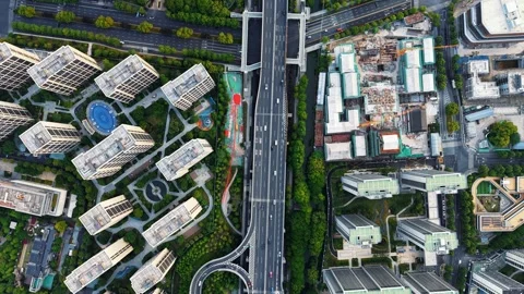 Aerial top down view of modern residential area featuring greenery, water Stock Footage 311559155