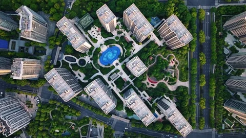 Aerial top down view of modern residential area featuring greenery, water Stock-Footage 311559744