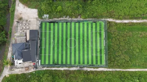 Aerial Top-Down View of Modern Mini Soccer Field Surrounded by Tropical Greenery Stock Footage 329838699