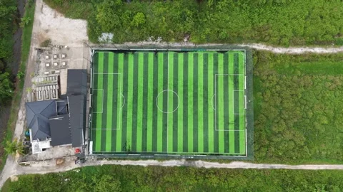 Aerial Top-Down View of Modern Mini Soccer Field Surrounded by Tropical Greenery Stock Footage 329838784