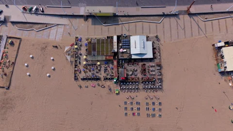 Aerial top down view of a modern beachfront restaurant with outdoor dining Stock Footage 338416777