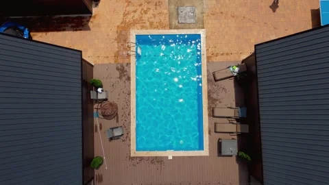 Aerial top down view of modern resort cottages with swimming pool Stock-Footage 343316770