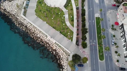 Aerial top down view of Molos Park on Limassol promenade, alley with palms Stock Footage 257466929