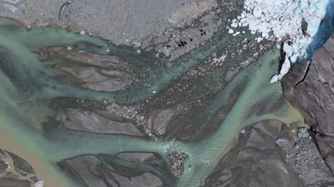 Aerial Top Down View Of Morteratsch Glacier Melting Into River Stock Footage 339099935