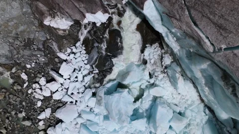 Aerial Top Down View Of Morteratsch Glacier Melting And Water Runoff Stock Footage 339100194