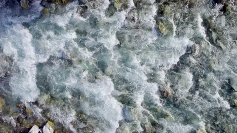 Aerial top down view of mountain seething river. Blue crystal clear water forms Stock-Footage 157486054