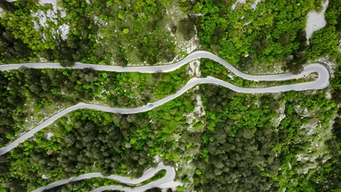 Aerial top down view of mountain serpentine road with many moving cars Stock Footage 216029039