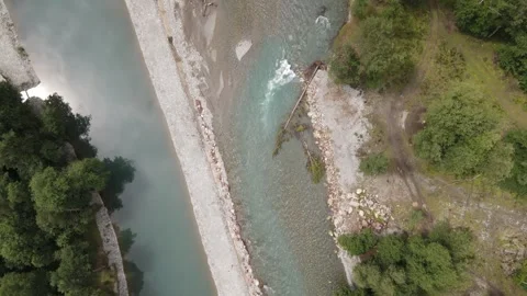 Aerial top-down view of mountain river and pond bank Stock Footage 337467621