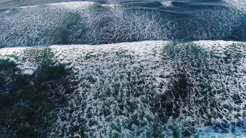 Aerial top down view of ocean waves breaking on reef 4k Stock Footage 83316619