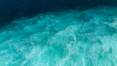 Aerial top down view of ocean waves crashing and foaming. Bali, Indonesia. Stock Footage 126997822