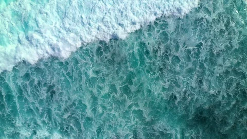 Aerial top down view of ocean waves crashing and foaming. Bali, Indonesia. Stock Footage 126999216
