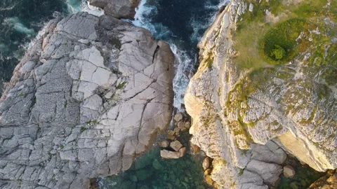 Aerial Top-Down View of Ocean Between Rocks - Drone Footage Stock Footage 310438247