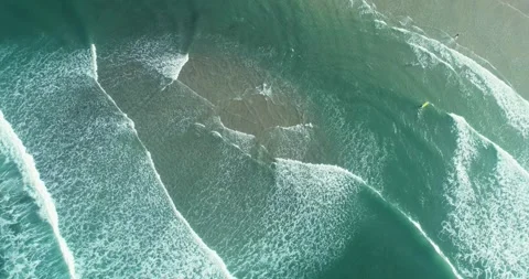 Aerial Top-Down View of Ocean Waves Breaking on the Shore, Sea Motion. Stock Footage 323132103