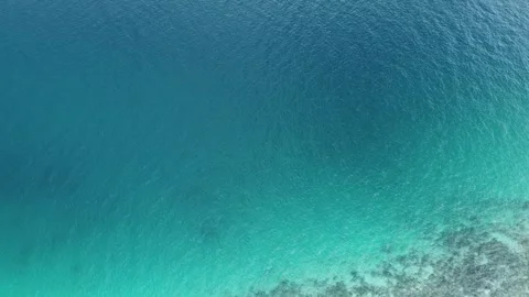 Aerial Top Down View of Ocean Ripples and Turquoise Sea Water Stockbeeldmateriaal 330700761