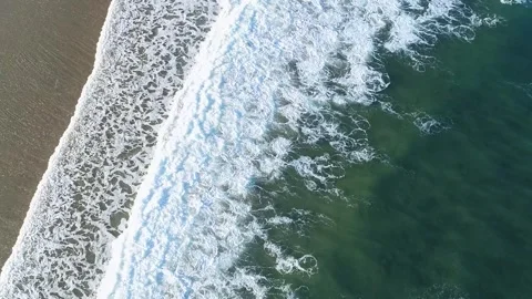Aerial top down view of ocean waves on a beach The Concept of nature's power Stock-Footage 331474322