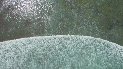 Aerial Top Down View Of Ocean Waves Crashing On Nyang Nyang Beach Stock Footage 340916751