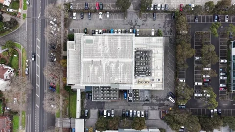 Aerial top down view of office building with parking lot and traffic Stock-Footage 342327411