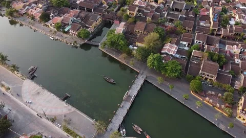 Aerial top down view of old heritage houses site, bridge and river in Hoi an Video stock 131824815