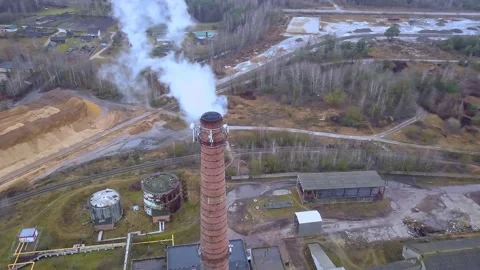 Aerial top down view of an old brick thermal power plant with smoking chimneys. Stock Footage 158732809
