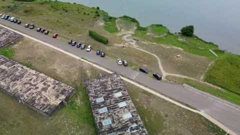 Aerial top-down view of old rectangular buildings near a waterfront. Paths Stock Footage 316782541
