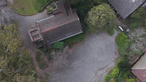 Aerial top down view of an old stone church in the woods Stock Footage 341905081