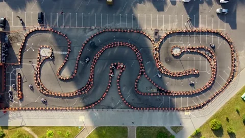 Aerial top down view of open go cart lap on a sunny day with carts Stock Footage 170392136