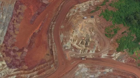 Aerial top down view of open pit bauxite mining quarry Stock Footage 328920528