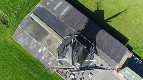 Aerial top down view of operational Dutch vintage windmill 4k Stock Footage 93554388